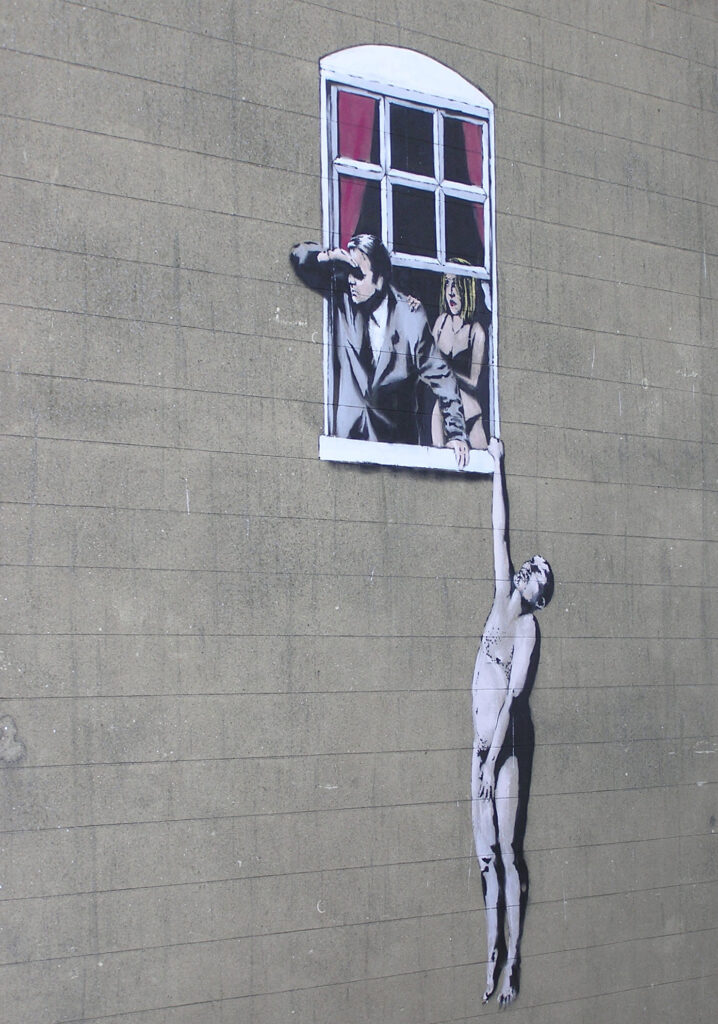 Hombre desnudo, imagen obra de Banksy, en Park Street, Bristol